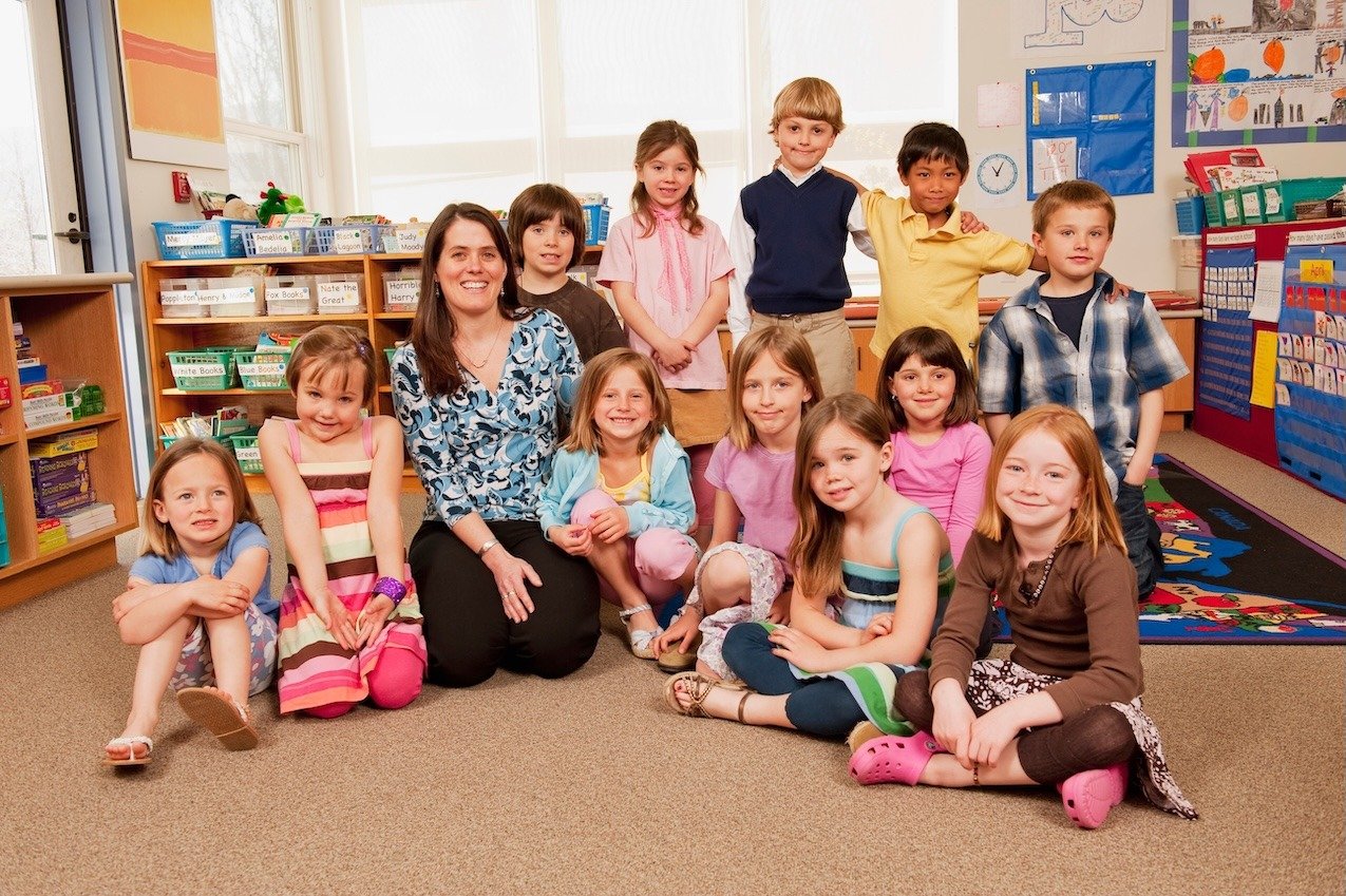 portrait-of-teacher-and-children-2023-11-27-05-08-36-utc copy