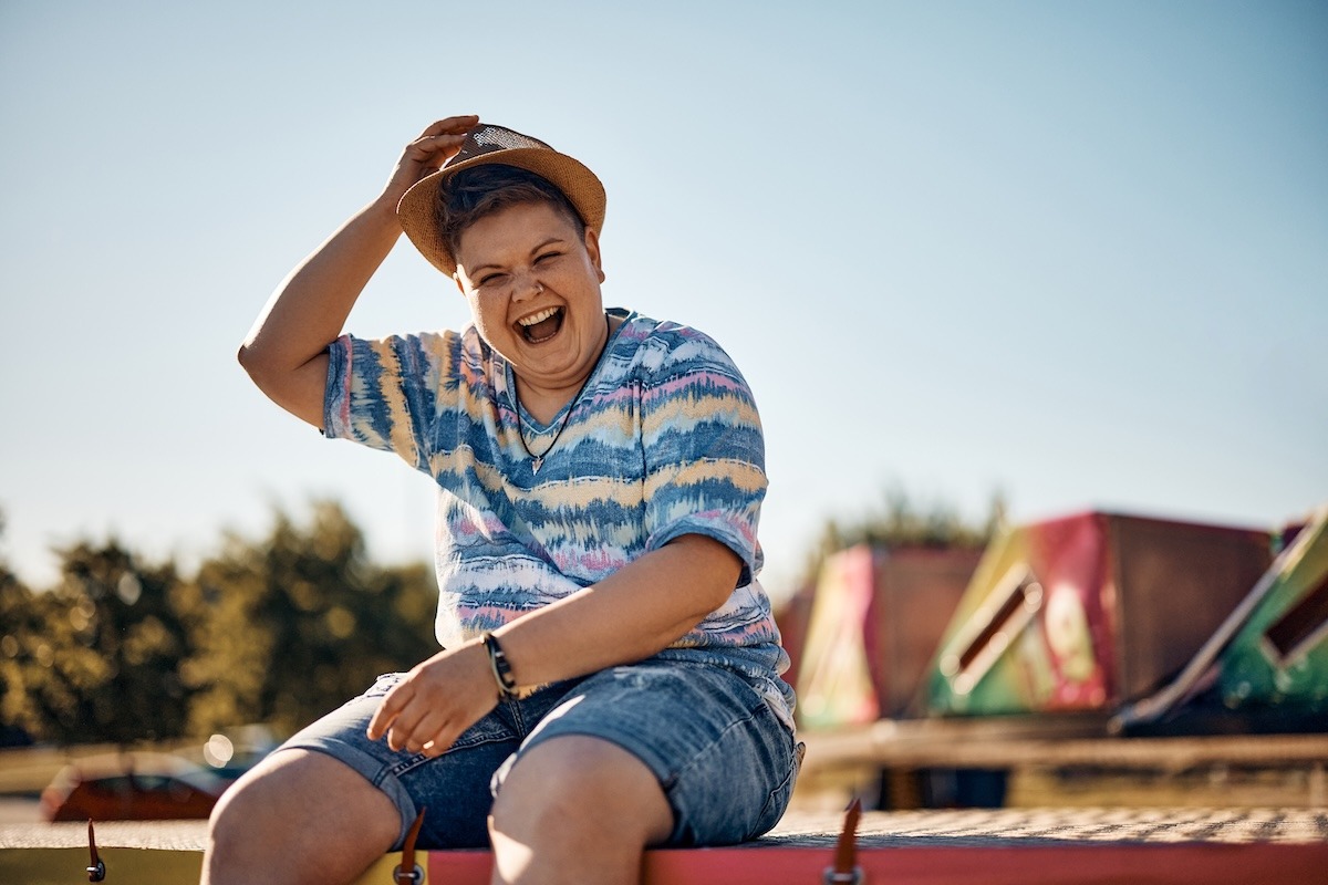 young-cheerful-woman-laughing-at-amusement-park-an-2024-12-13-20-19-29-utc copy